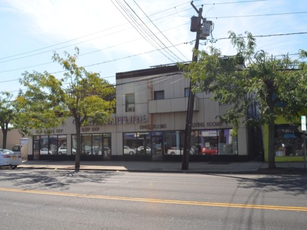 exterior of mixed-use building for sale at maltz auctions