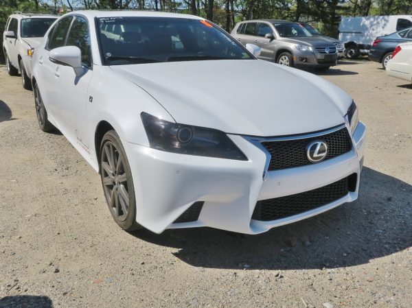 front of white lexus automobile for sale by maltz auctions in new york city