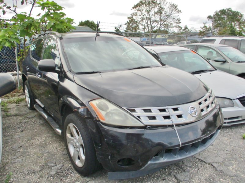 front of black nissan car for sale at maltz auctions in new york city