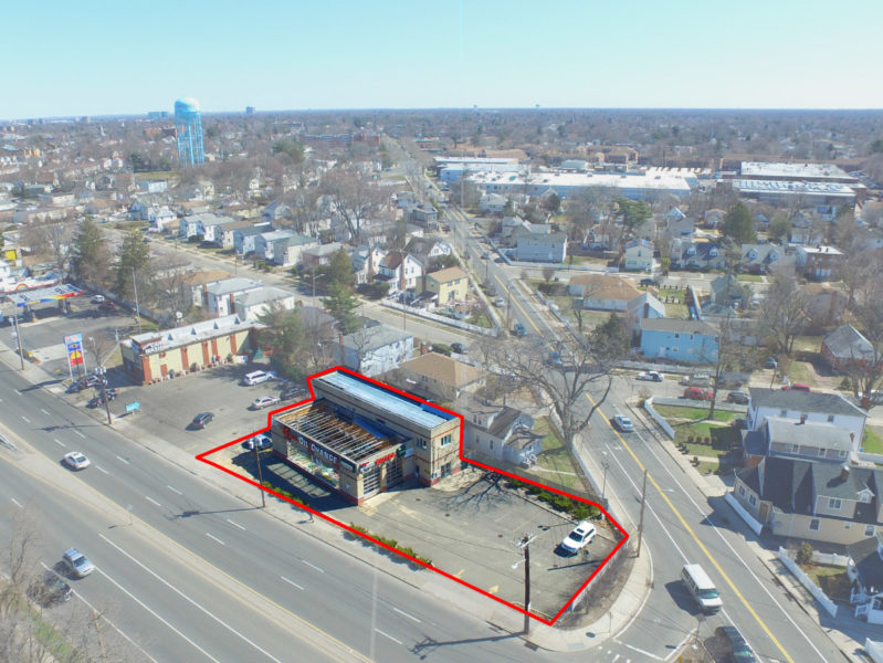 birds-eye of prime corner retail lot and building - buy at maltz auctions