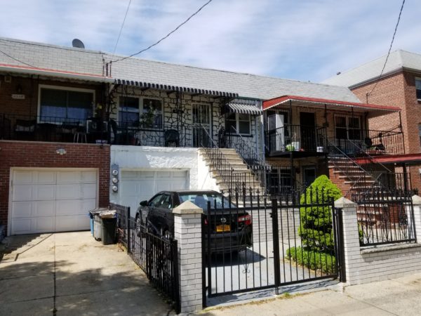 outside of two family home for sale on east elmhurst at maltz auctions in new york