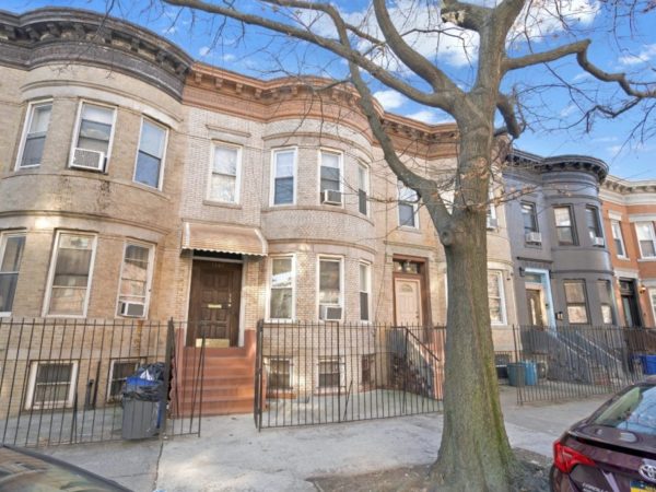 outside of 3 family brownstone home for sale at maltz auctions