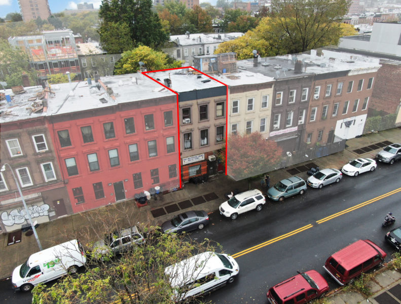 aerial view of exterior of mixed use building for sale by maltz auctions