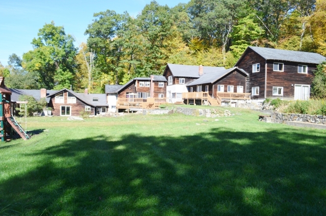exterior of country retreat for sale at maltz auctions