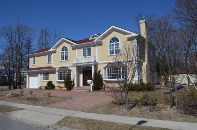 exterior of custom home for sale at maltz auctions in new york