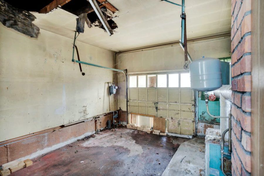 interior unfinished garage of home for sale at maltz auctions in new york