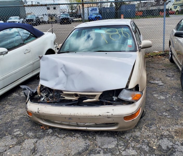 damaged tan car for sale at maltz auto auctions in new york