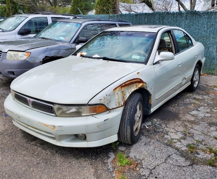damaged white vehicle for sale at maltz auto auctions in new york