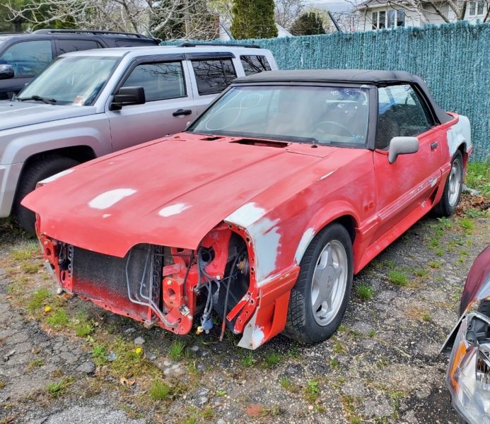damaged red car for sale at maltz auto auctions in new york
