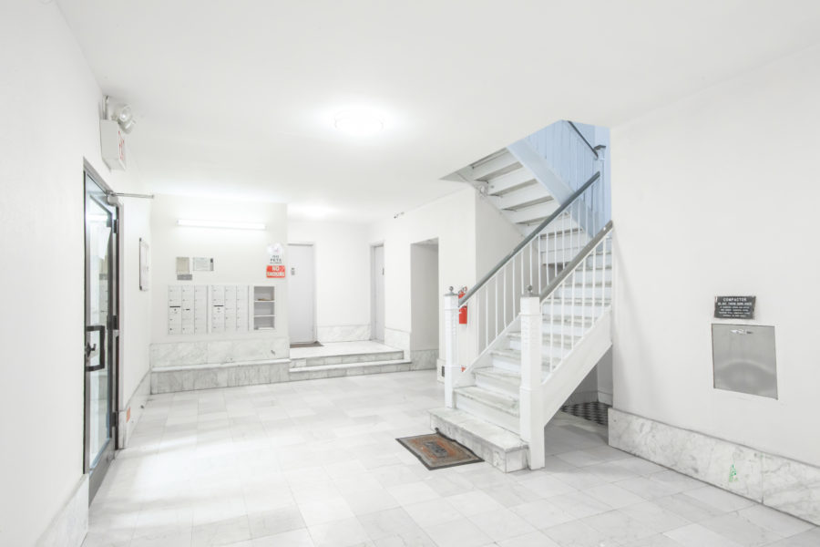 interior entryway of duplex condo for sale at maltz auctions in new york