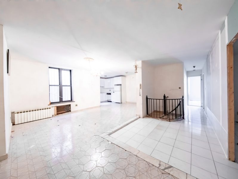 interior living area of duplex condo for sale at maltz auctions in new york