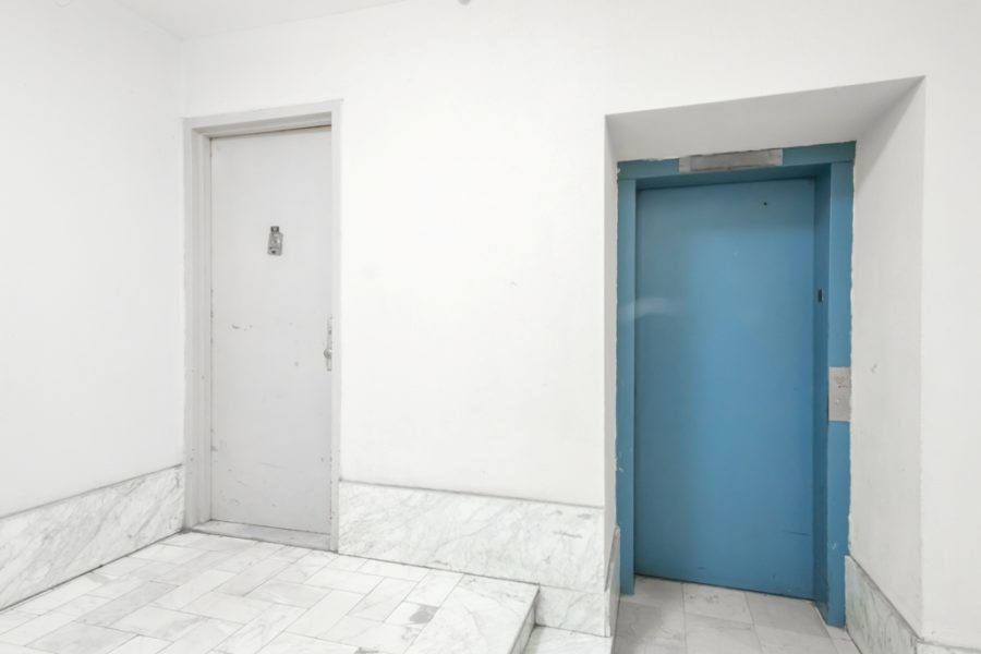 doors of duplex condo for sale at maltz auctions in new york