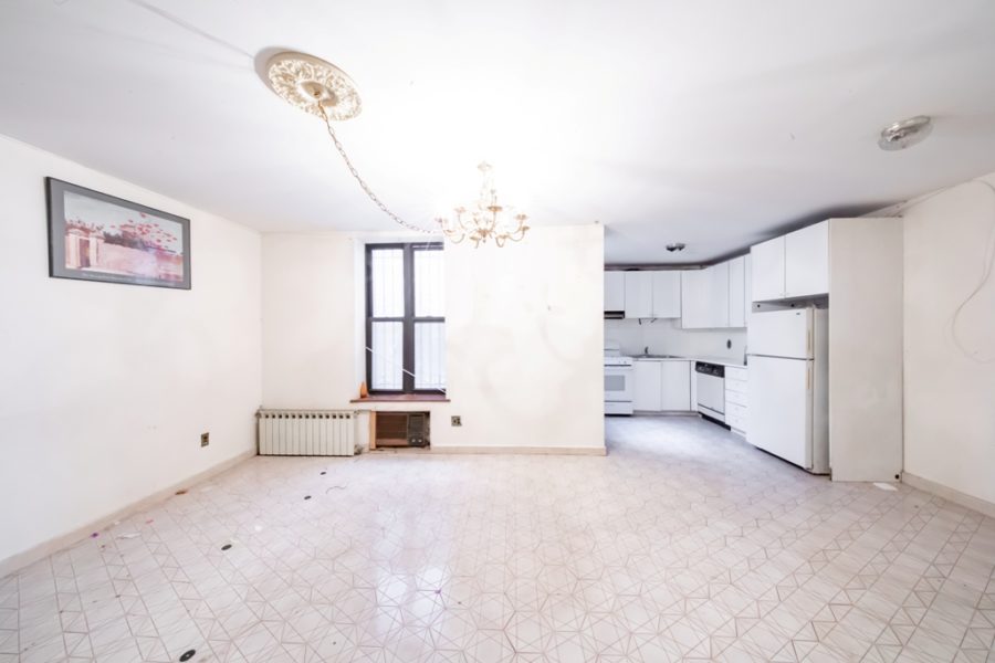 kitchen area of duplex condo for sale at maltz auctions in new york