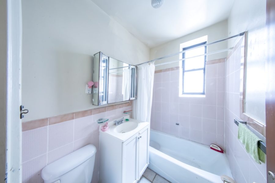 bathroom of duplex condo for sale at maltz auctions in new york