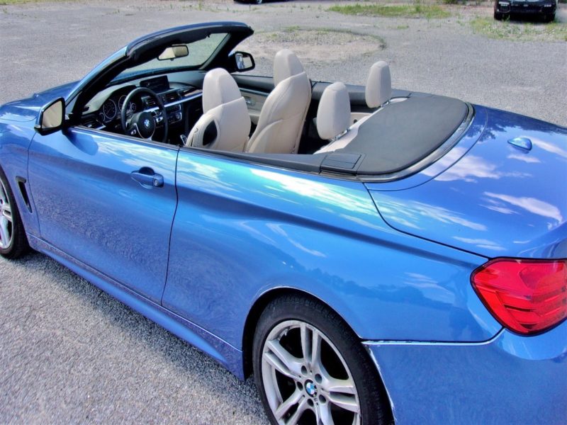 side of blue bmw for sale at maltz auto auctions