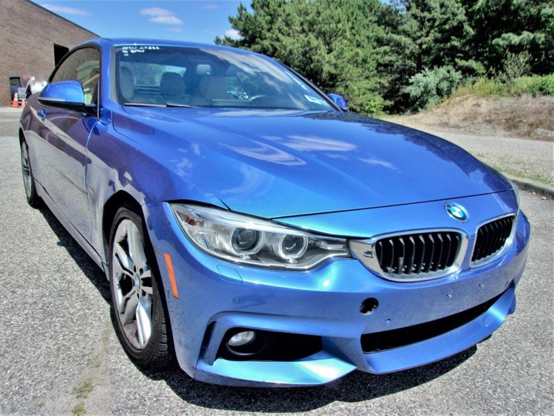 front of blue bmw vehicle for sale at maltz auto auctions