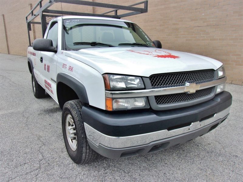 front of white truck for sale at maltz auto auctions