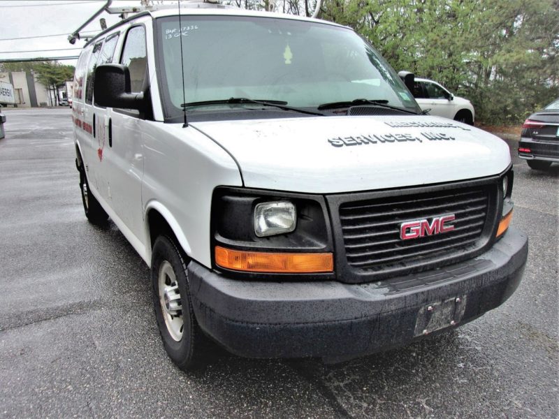 front of white van for sale at maltz auto auctions