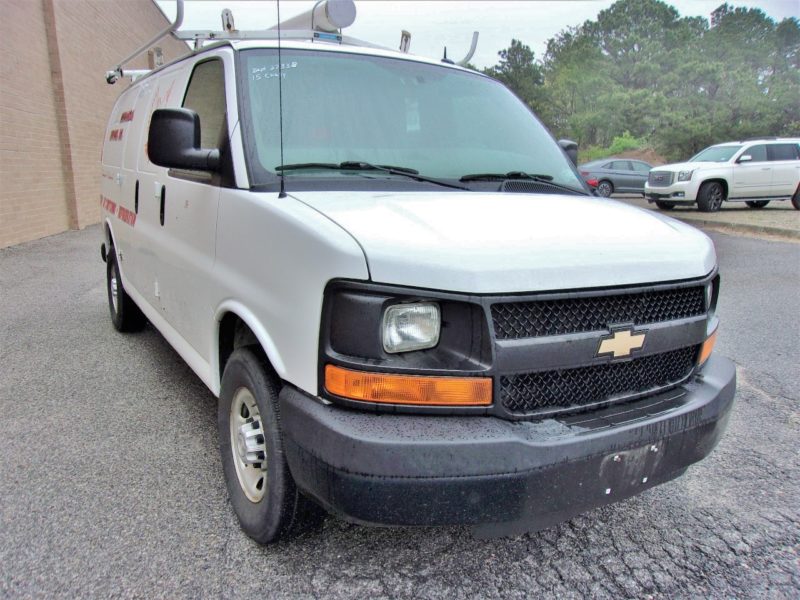 front of white van for sale at maltz auto auctions