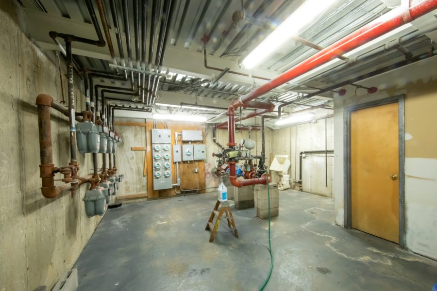 basement and plumbing of 16 unit multifamily building for sale at maltz auctions