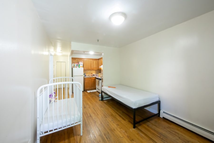 bedroom of 16 unit multifamily building for sale at maltz auctions