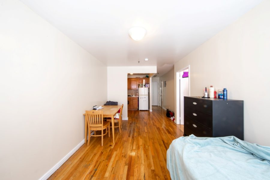 bedroom of 16 unit multifamily building for sale at maltz auctions