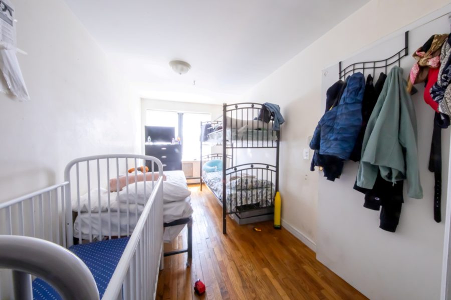 bedroom inside 16 unit multifamily building for sale at maltz auctions