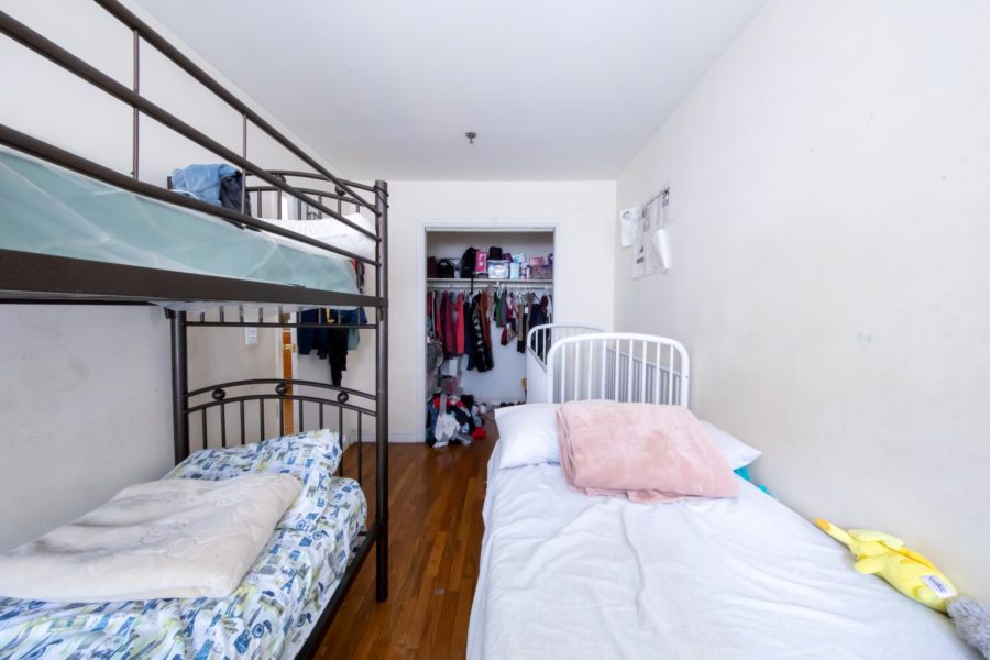 bedroom inside 16 unit multifamily building for sale at maltz auctions