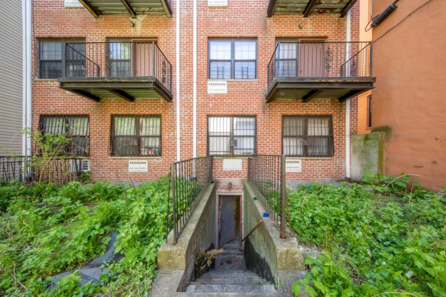 outside of 16-unit multifamily building for sale at maltz auctions in new york