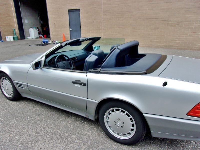 side of silver convertible for sale at maltz automobile auctions