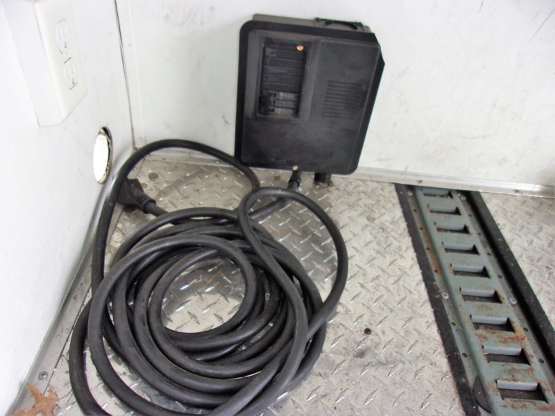 cord and power outlet inside trailer for sale at maltz auctions in new york