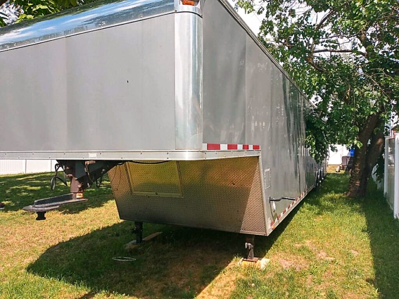 frontside of millenium trailer up for sale at maltz auctions in new york city