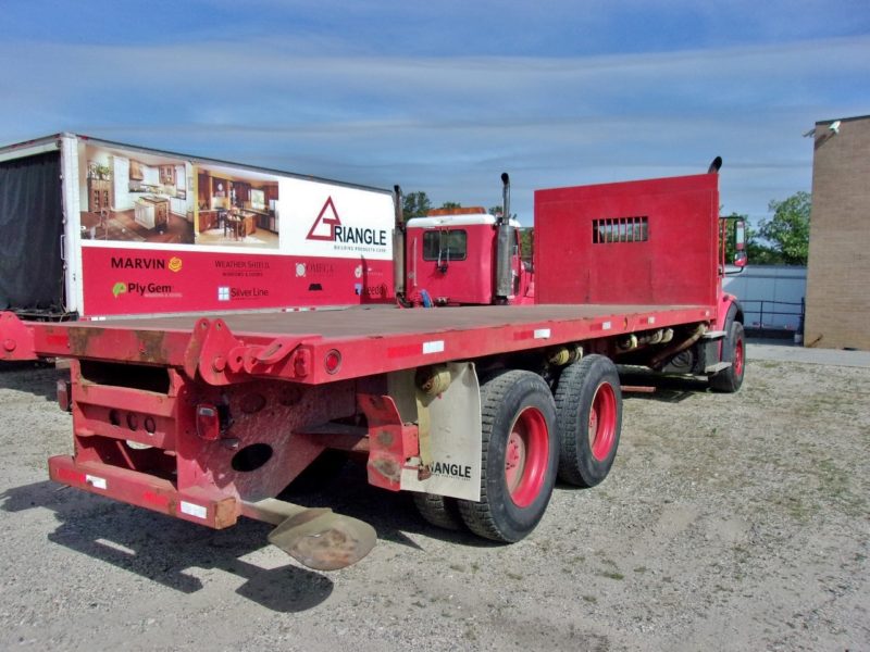 angled side view of truck for sale at maltz auctions in new york