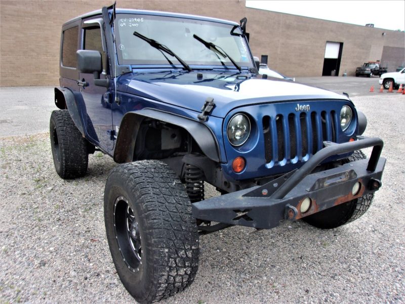 Front side of blue Jeep - buy at auction at Maltz Auctions