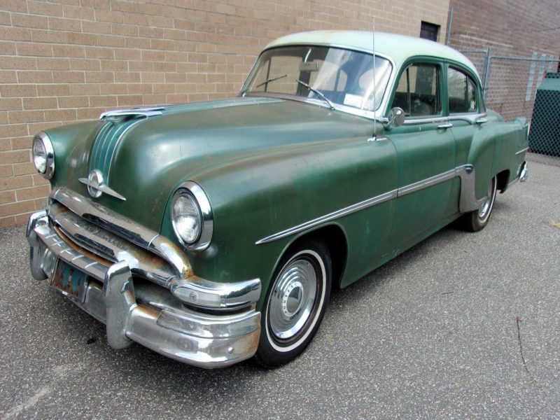Side view of old Pontiac car up for auction at Maltz Auctions