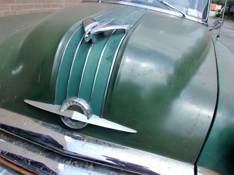 Close up of front of old Pontiac car up for auction at Maltz Auctions