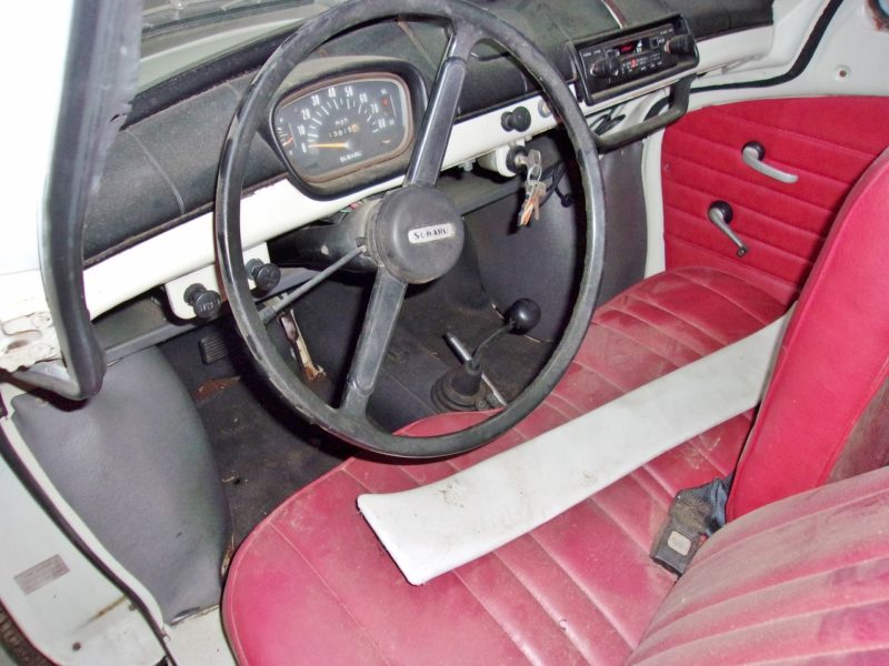 interior view of steering wheel and seats of private car for sale at Maltz Auctions in New York and New Jersey