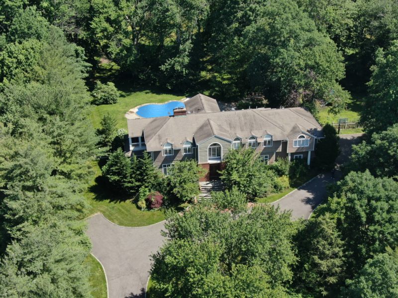 drone view of 6 bedroom luxury home on 2 plus acres of land at maltz auctions