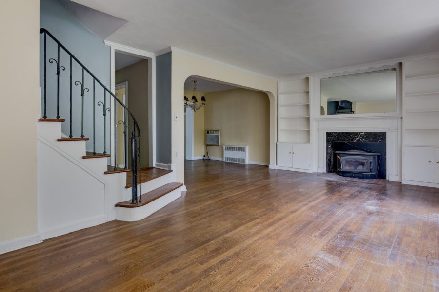 fireplace, mantel, and stairs of 4 bedroom home for sale at maltz auctions