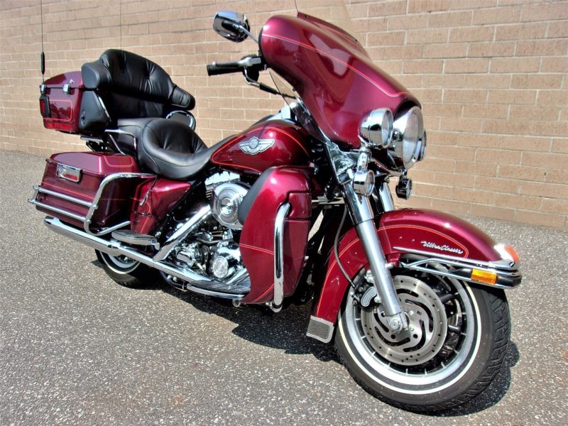 side view of red motorcycle up for auto auction at maltz auctions