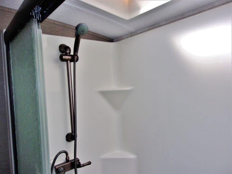 Close up of shower head in travel trailer - find more private vehicles for sale at Maltz Auctions
