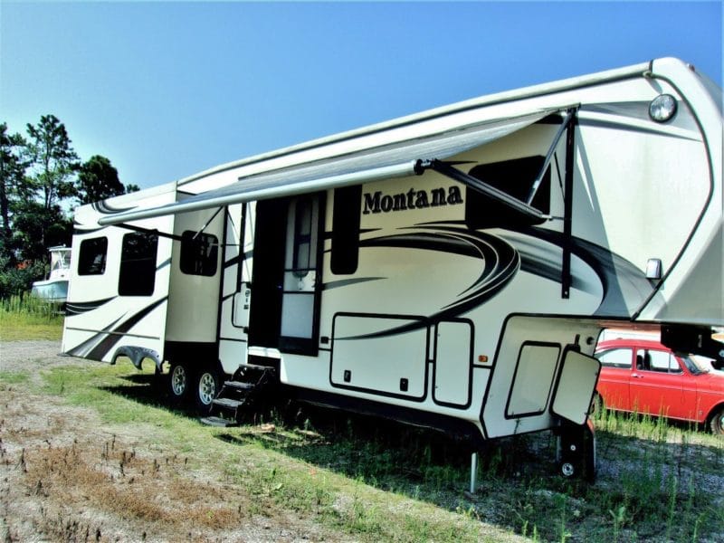 Outside of Montana camper with shade - buy at Maltz Auctions