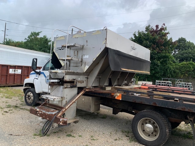 Truck with heavy equipment up for auction at Maltz Auctions