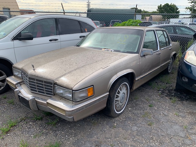 Tan car up for auto auction at Maltz Auctions in New York