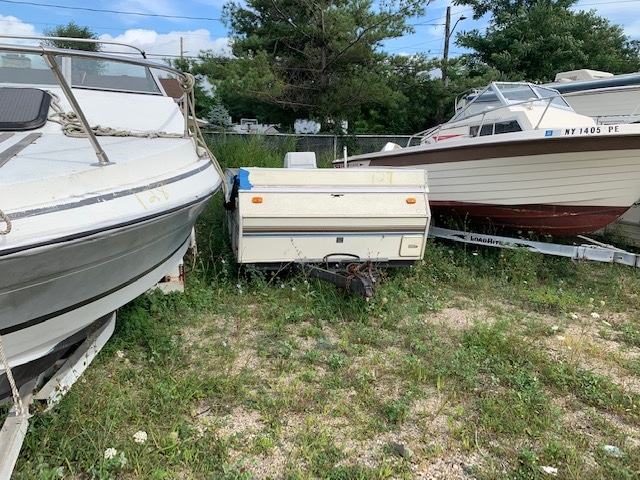 Equipment in between two boats for sale at auction at Maltz Auctions in New York