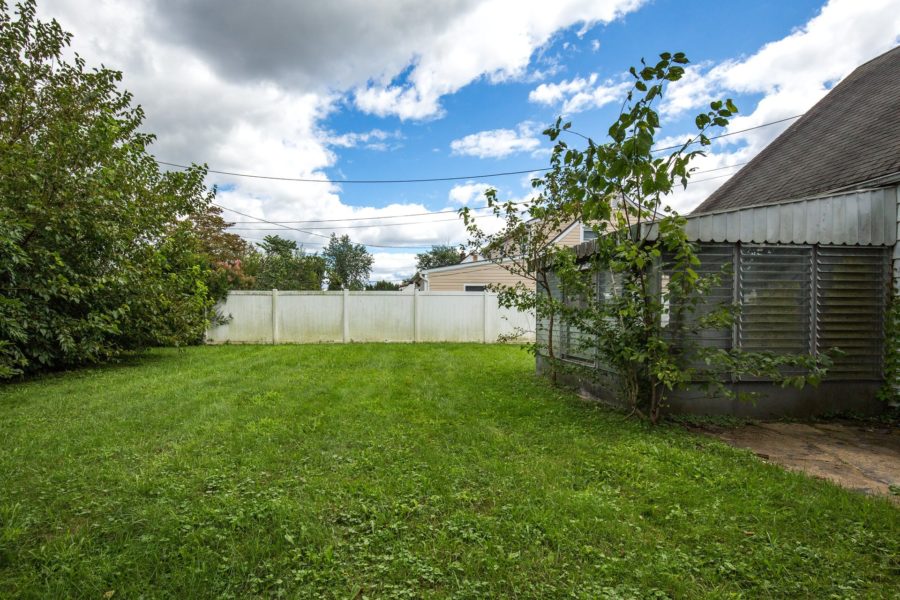 backyard of land for sale at Maltz Auctions