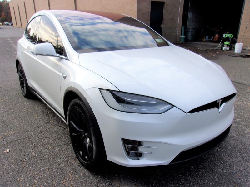 white telsa vehicle for sale at maltz auto auctions in new york city