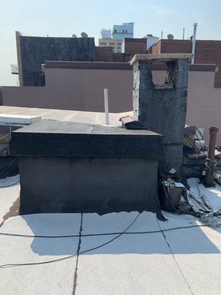 roof of mixed use building for sale by maltz auctions